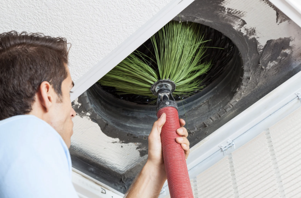 man performing air duct cleaning in port charlotte